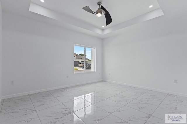7332 San Andres St, Brownsville, TX 78520 - spare room with light marble finish floors, a ceiling fan, recessed lighting, baseboards, and a raised ceiling