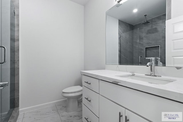 7332 San Andres St, Brownsville, TX 78520 - bathroom featuring marble finish flooring, vanity, a shower stall, toilet, and baseboards
