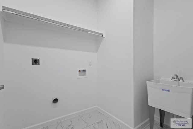 7332 San Andres St, Brownsville, TX 78520 - washroom with washer hookup, light marble finish floors, baseboards, and electric dryer hookup