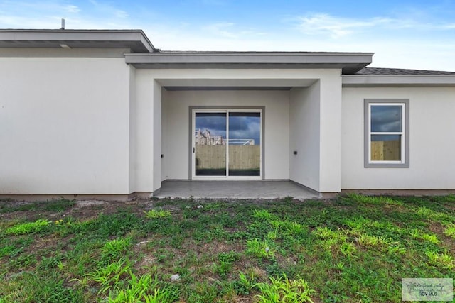 7332 San Andres St, Brownsville, TX 78520 - rear view of house featuring stucco siding and a patio