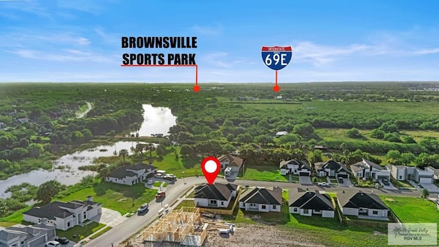 7332 San Andres St, Brownsville, TX 78520 - aerial perspective of suburban area with a nearby body of water