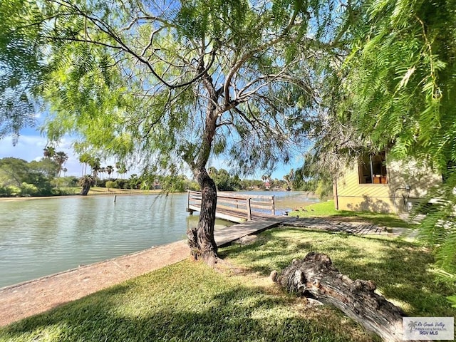 2901 Central Blvd Unit 306, Brownsville, TX 78520 - dock featuring a water view and a yard