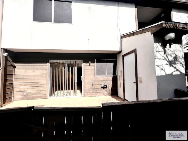 2901 Central Blvd Unit 306, Brownsville, TX 78520 - rear view of house with stucco siding