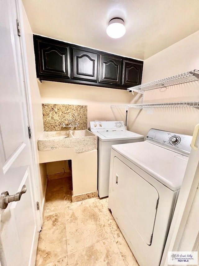 2901 Central Blvd Unit 306, Brownsville, TX 78520 - laundry room featuring independent washer and dryer and cabinet space