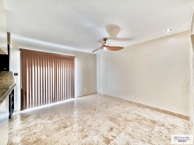2901 Central Blvd Unit 306, Brownsville, TX 78520 - unfurnished living room featuring a ceiling fan and baseboards