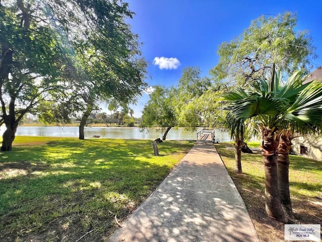 2901 Central Blvd Unit 306, Brownsville, TX 78520 - view of community featuring a water view and a yard