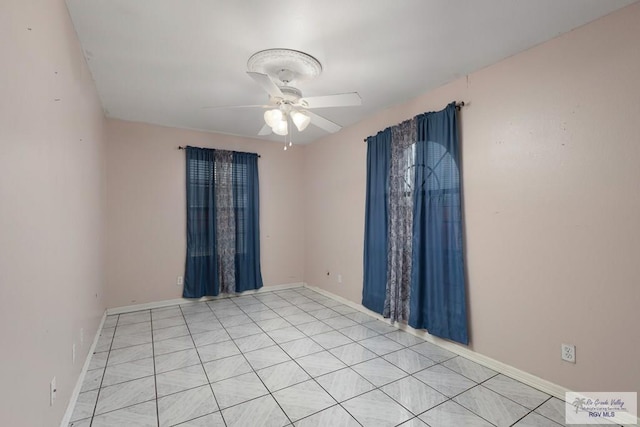 spare room featuring ceiling fan