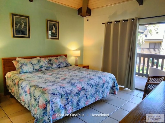 tiled bedroom featuring beamed ceiling and access to exterior