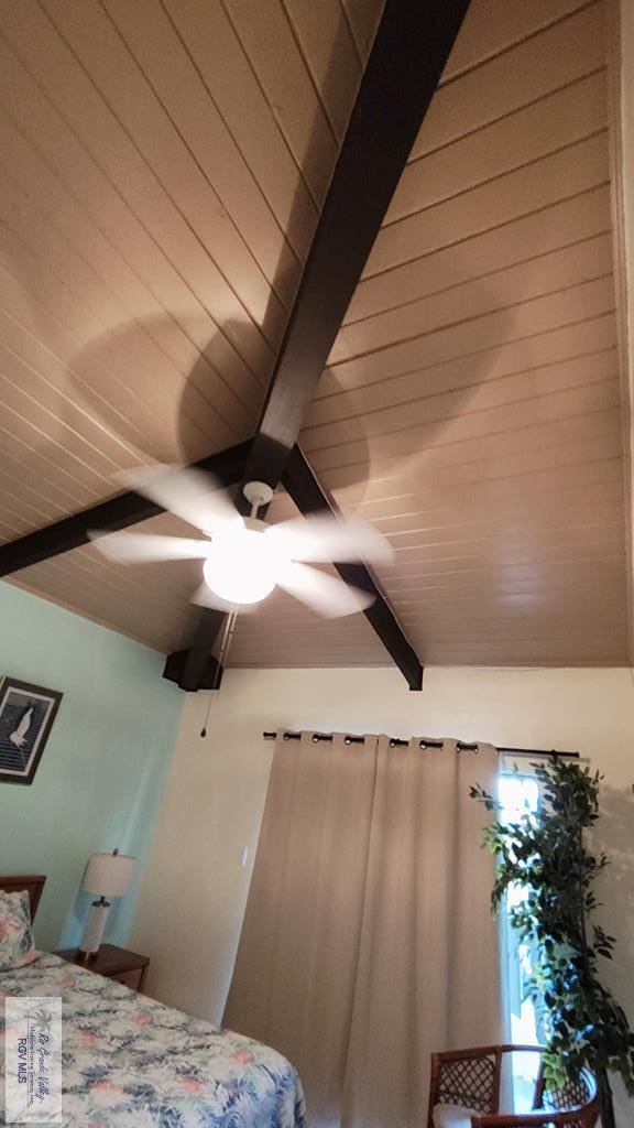 6608 Padre Blvd Unit D-253, South Padre Island, TX 78597 - bedroom with a wood ceiling with exposed beams and ceiling fan