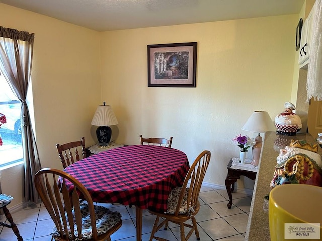 dining space with light tile patterned floors