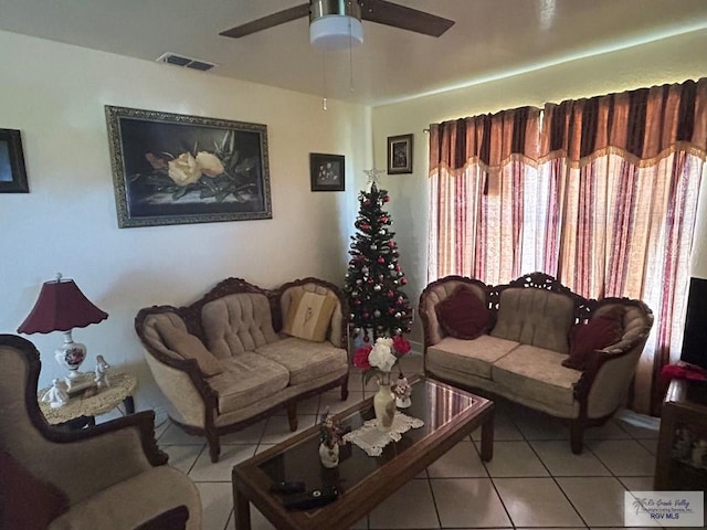 living room featuring ceiling fan and light tile patterned flooring