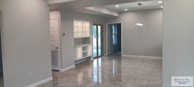 entryway with a notable chandelier