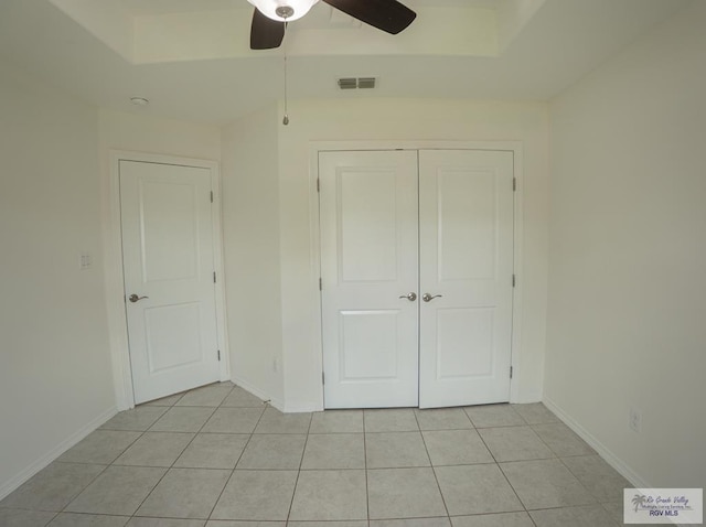 17077 Tangelo Ave, Harlingen, TX 78552 - unfurnished bedroom with light tile patterned floors, a closet, and a ceiling fan