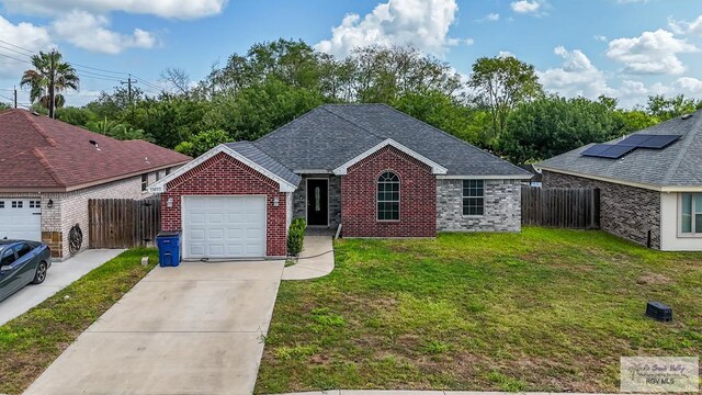 17077 Tangelo Ave, Harlingen, TX 78552 - single story home featuring an attached garage, driveway, and brick siding