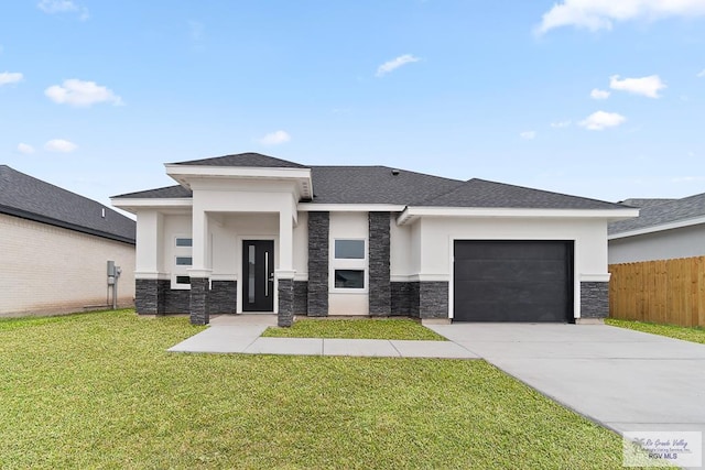 prairie-style house with a front lawn and a garage