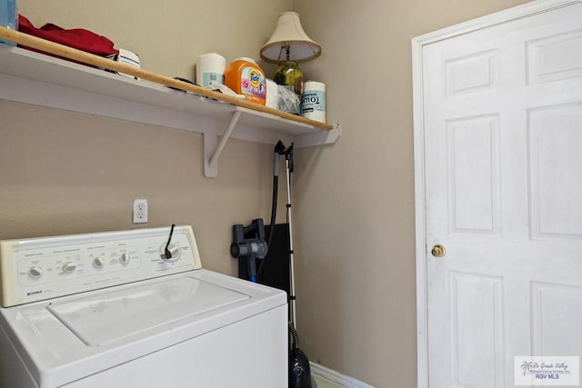 laundry area with washer / dryer