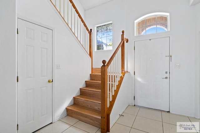 entryway with light tile patterned floors