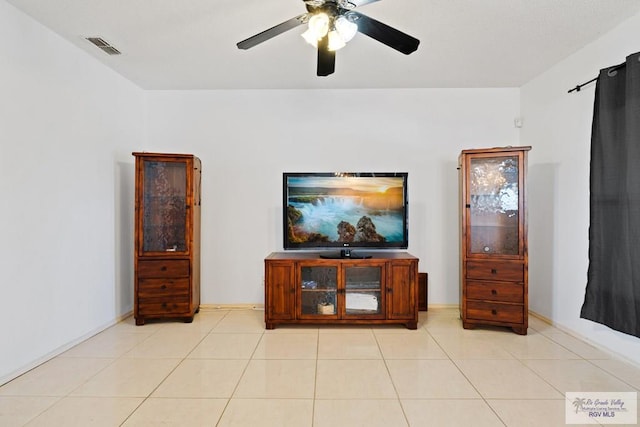 interior space with ceiling fan and light tile patterned floors