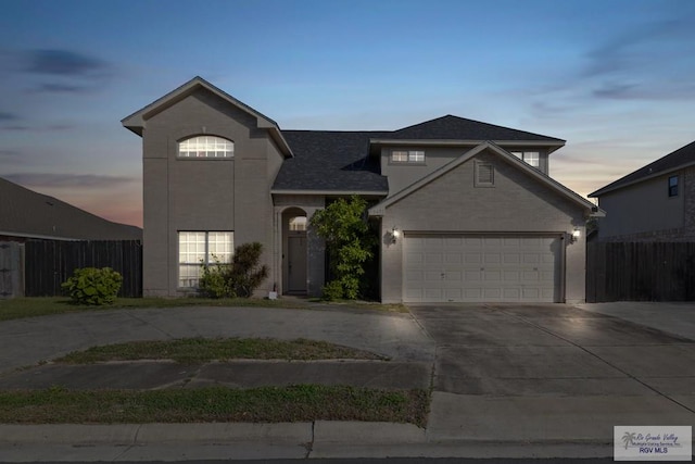 front of property with a garage