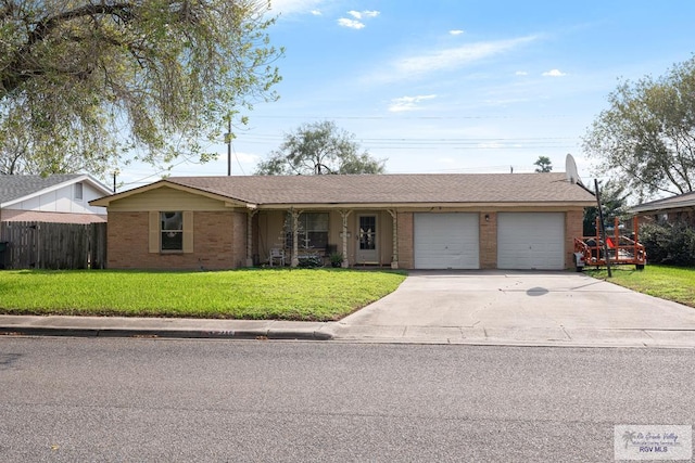 single story home with a garage and a front lawn