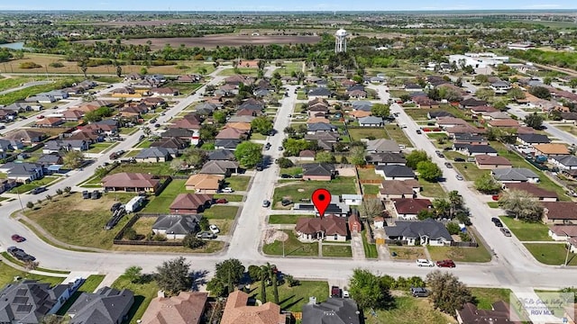 birds eye view of property with a residential view