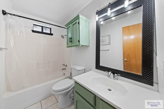 bathroom with vanity, tile patterned floors, toilet, and shower / tub combo with curtain