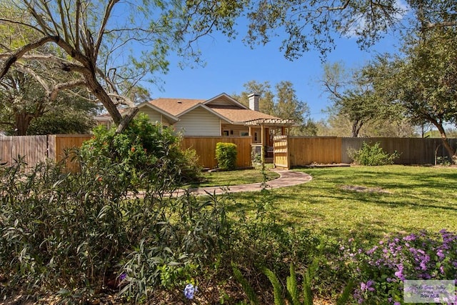 view of yard featuring a fenced backyard