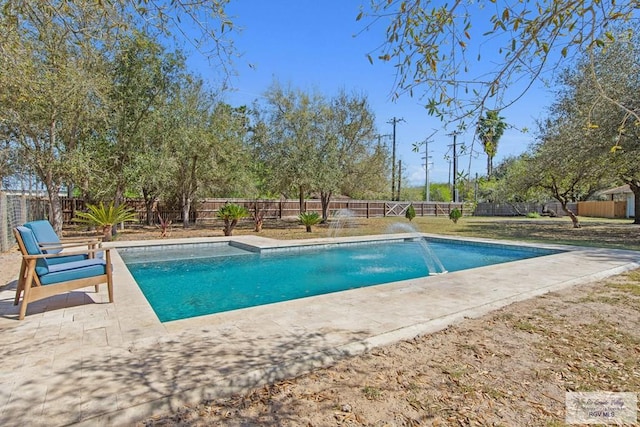 view of pool featuring a fenced in pool, a fenced backyard, and a patio area