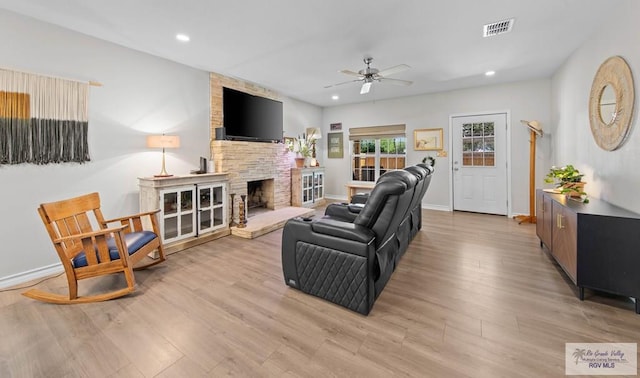 living room featuring recessed lighting, visible vents, a ceiling fan, and light wood finished floors