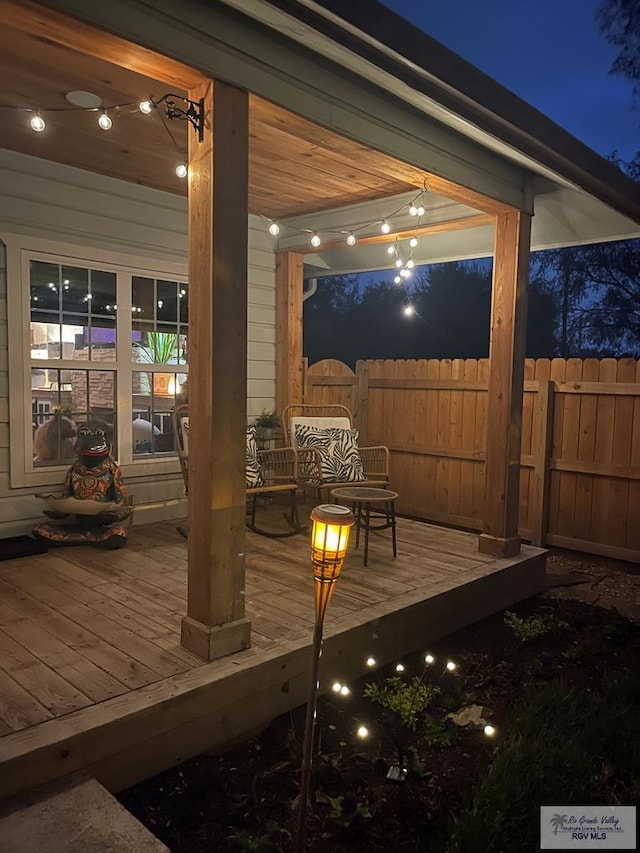 deck at night with fence