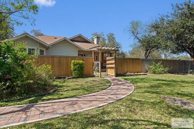 view of yard with fence private yard and a pergola