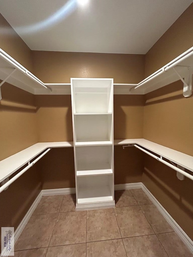 spacious closet featuring tile patterned floors