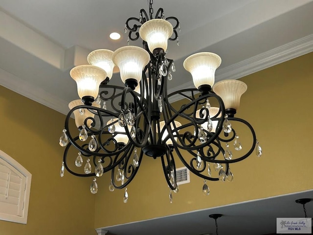 room details featuring a notable chandelier and ornamental molding