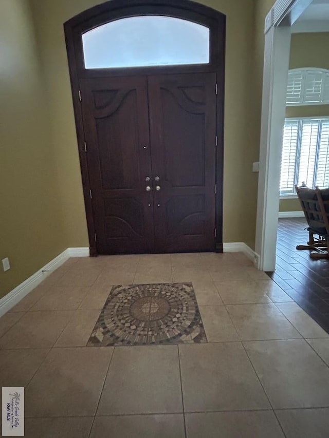 entrance foyer with light tile patterned flooring