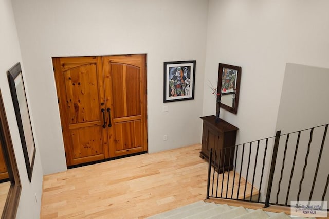 foyer entrance with light wood-type flooring