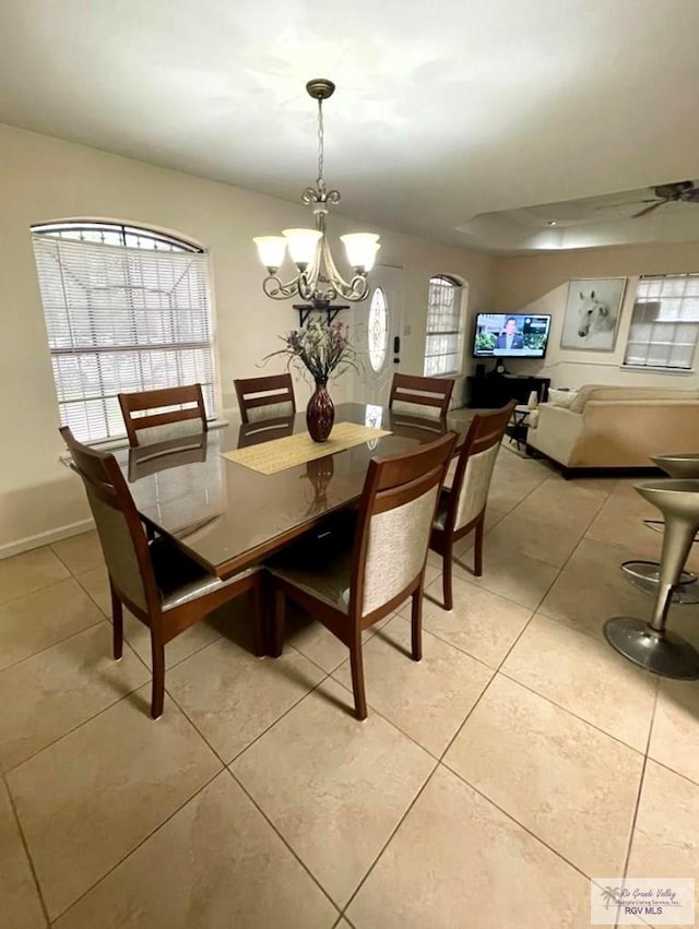 dining room featuring light tile patterned floors and a notable chandelier