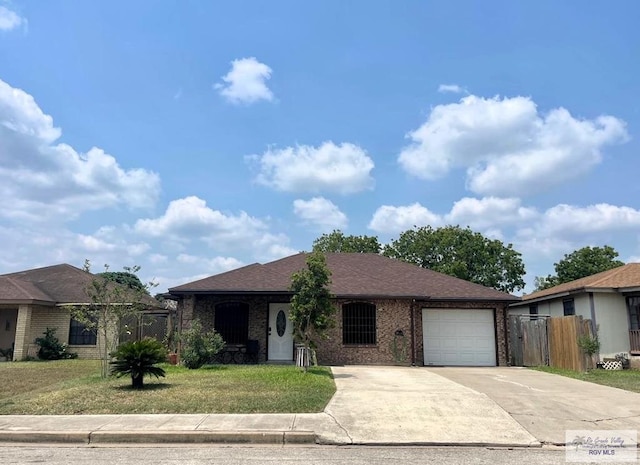 single story home with a garage and a front yard