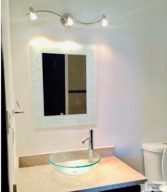 bathroom with vanity and toilet