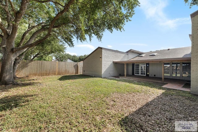 716 E Palm Valley Dr, Harlingen, TX 78550 - view of yard with french doors and a patio