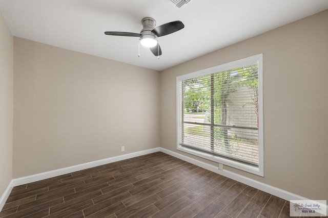 716 E Palm Valley Dr, Harlingen, TX 78550 - unfurnished room with dark wood-style flooring and a ceiling fan