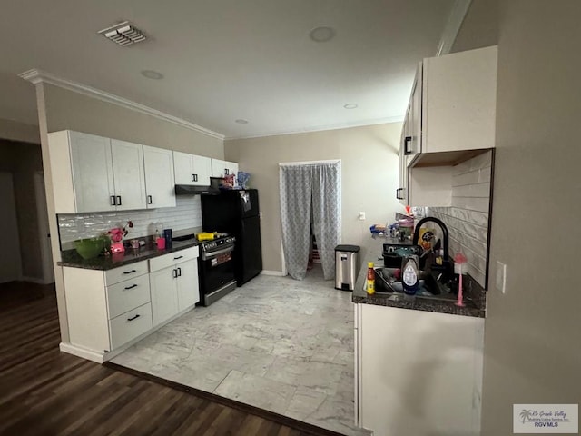 kitchen with light wood-type flooring, tasteful backsplash, ornamental molding, black appliances, and white cabinetry