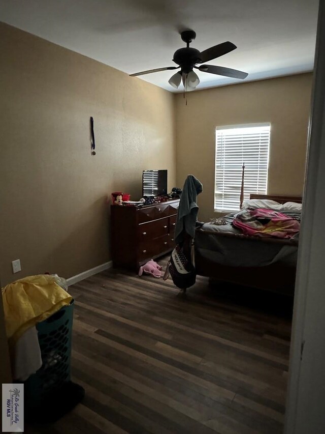 bedroom featuring ceiling fan and dark hardwood / wood-style floors