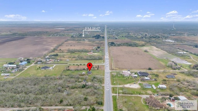 birds eye view of property featuring a rural view