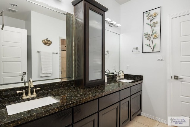 bathroom with vanity and tile patterned floors