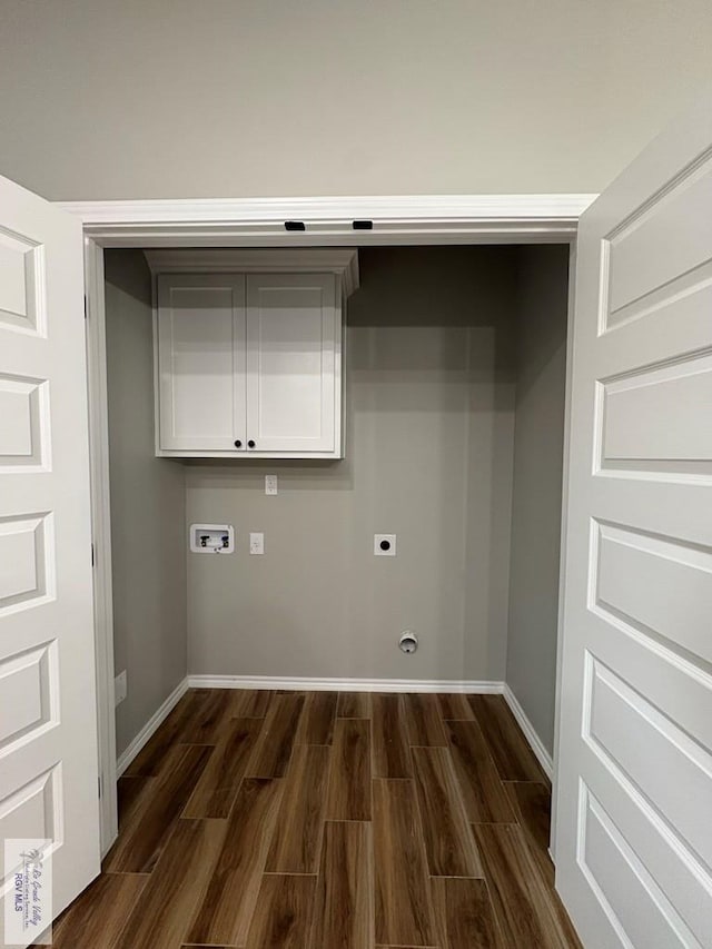 laundry area with cabinet space, baseboards, dark wood-style floors, washer hookup, and electric dryer hookup