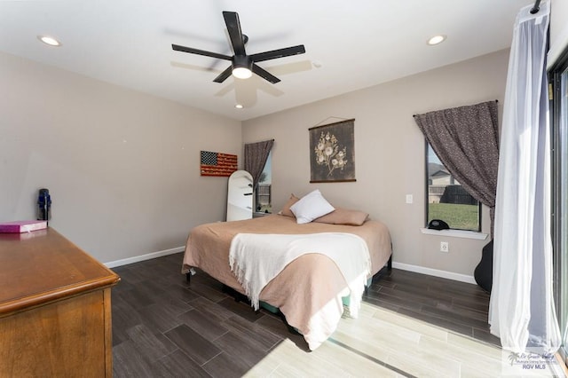 bedroom featuring a ceiling fan, wood finish floors, baseboards, and recessed lighting