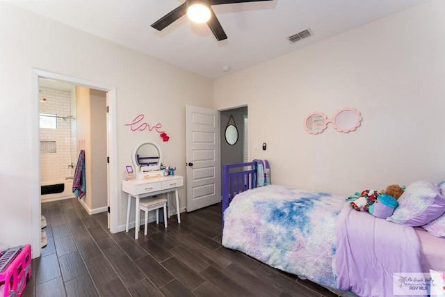 bedroom with baseboards, visible vents, dark wood finished floors, and a ceiling fan