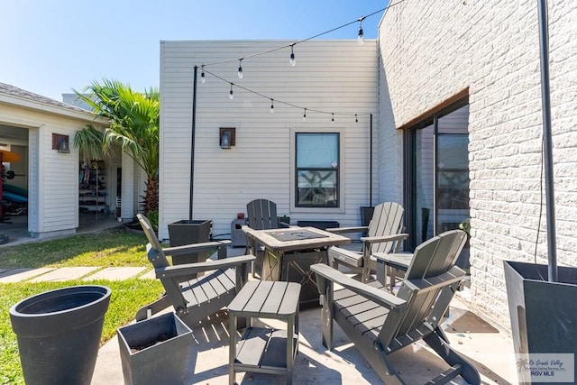 view of patio / terrace with a fire pit