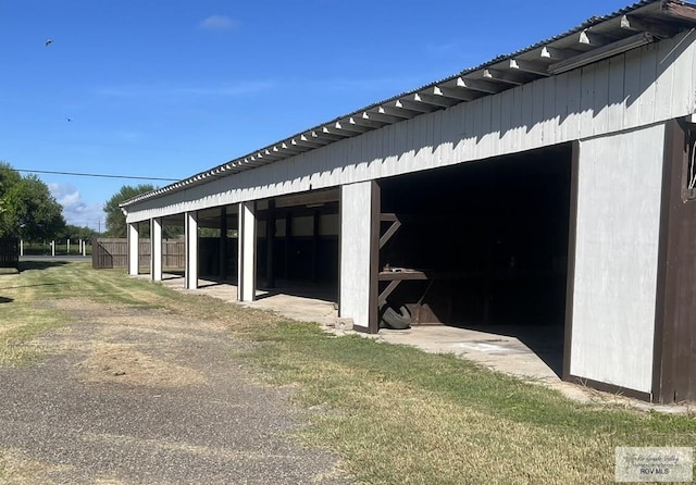 view of home's exterior featuring an outbuilding