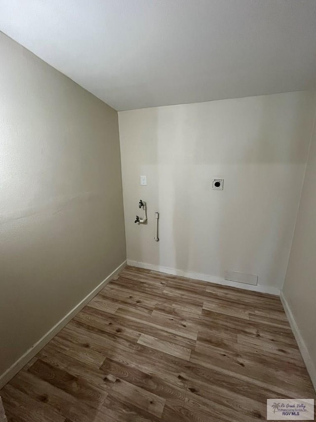 laundry area with hardwood / wood-style floors and electric dryer hookup